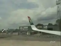 Самолет крылом перевернул грузовик.